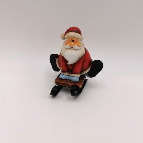 Weihnachtsmann auf Schlitten sitzend